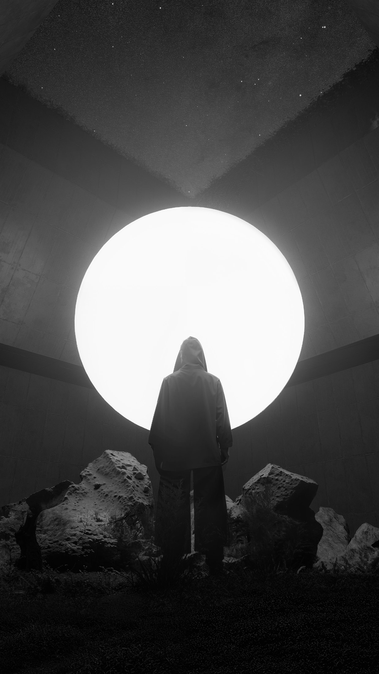 The Cube in black and white, with a solitary figure beneath a luminous circular opening inside a brutalist space